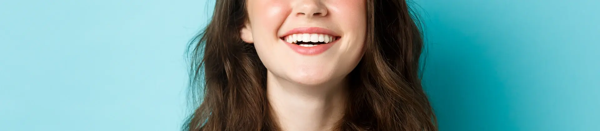 Close-up of a smiling woman showing healthy teeth
