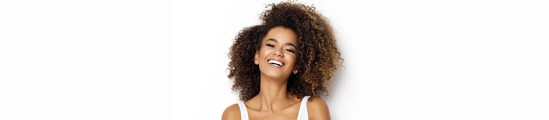 Woman with curly hair smiling