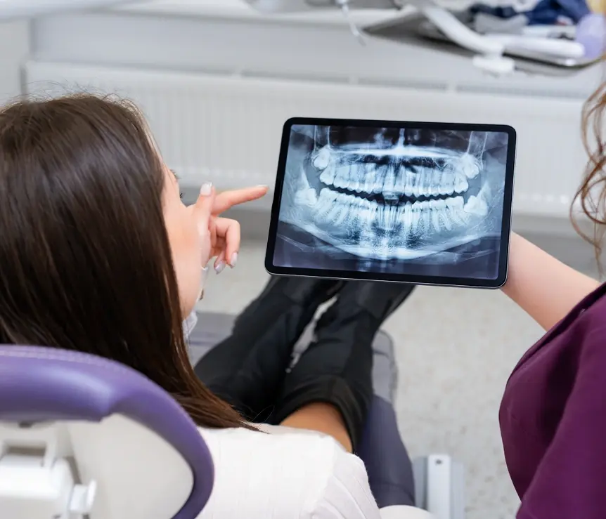 Dentist reviewing a patient's digital dental X-ray
