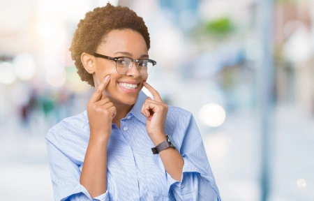 Happy woman highlighting her smile