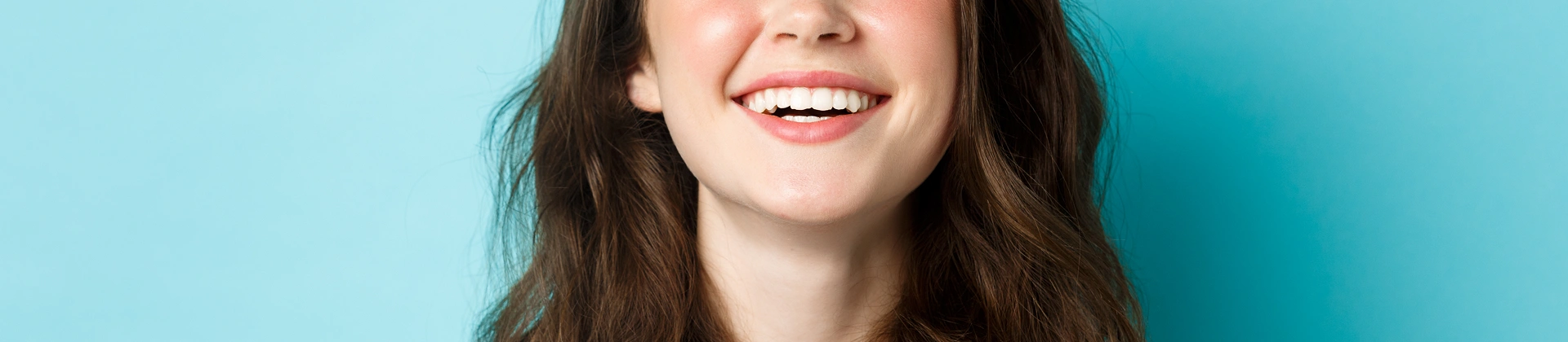 Close-up of a smiling woman showing healthy teeth