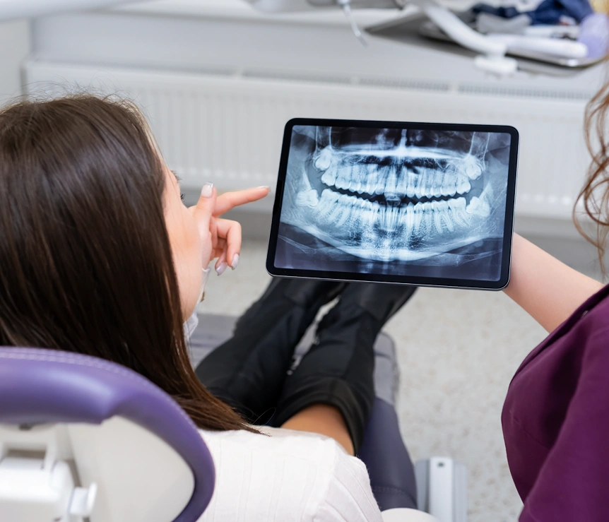 Dentist reviewing a patient's digital dental X-ray